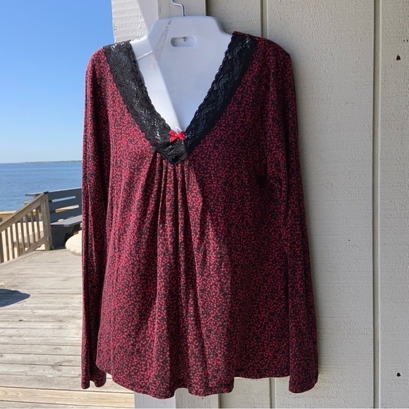 It’s red and black top has a Lovely lace V-neck with a little red bow. So soft! - Picture 1 of 5